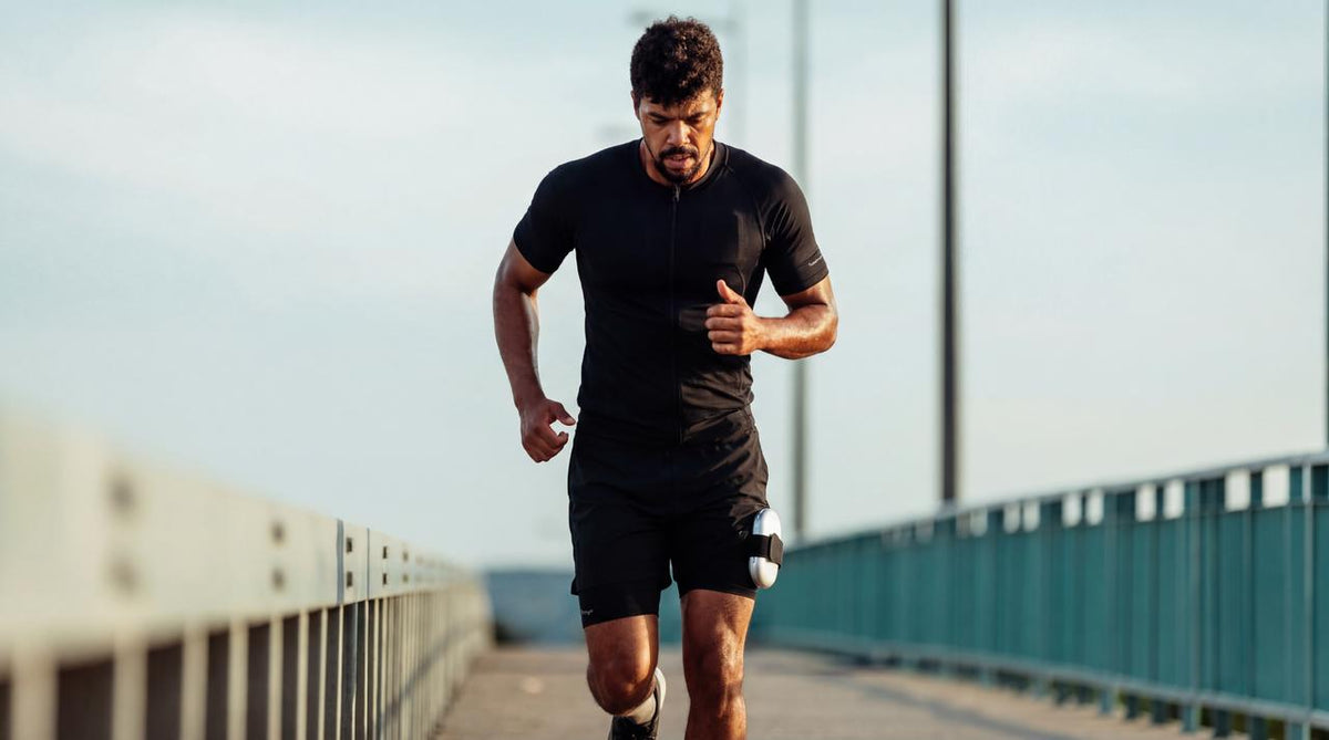Man running outdoors in a Full-Body EMS Suit