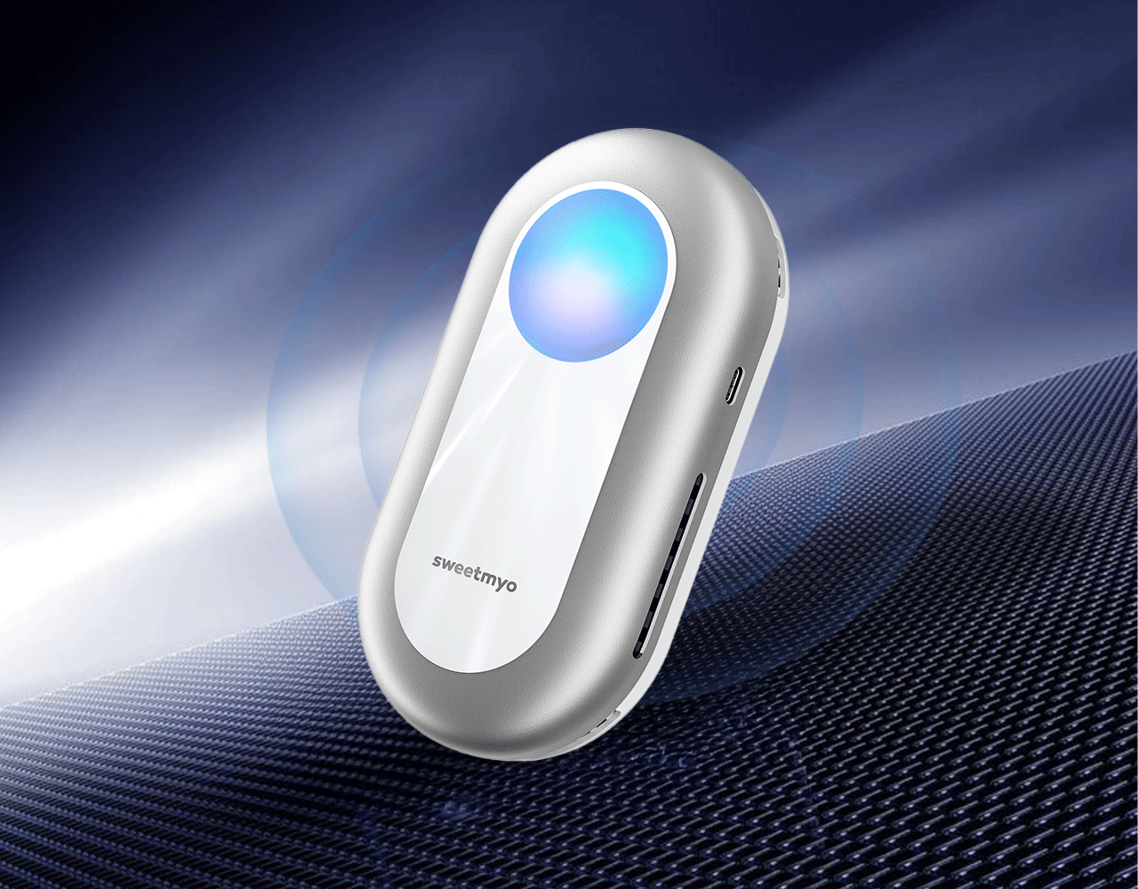 Silver SweetMyo controller with a glowing blue center rests on dark textured fabric against a blue technical background.